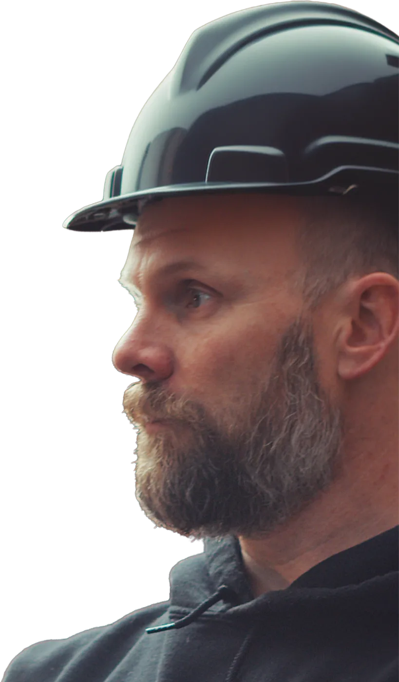 Jon Strand on a jobsite in a hard hat