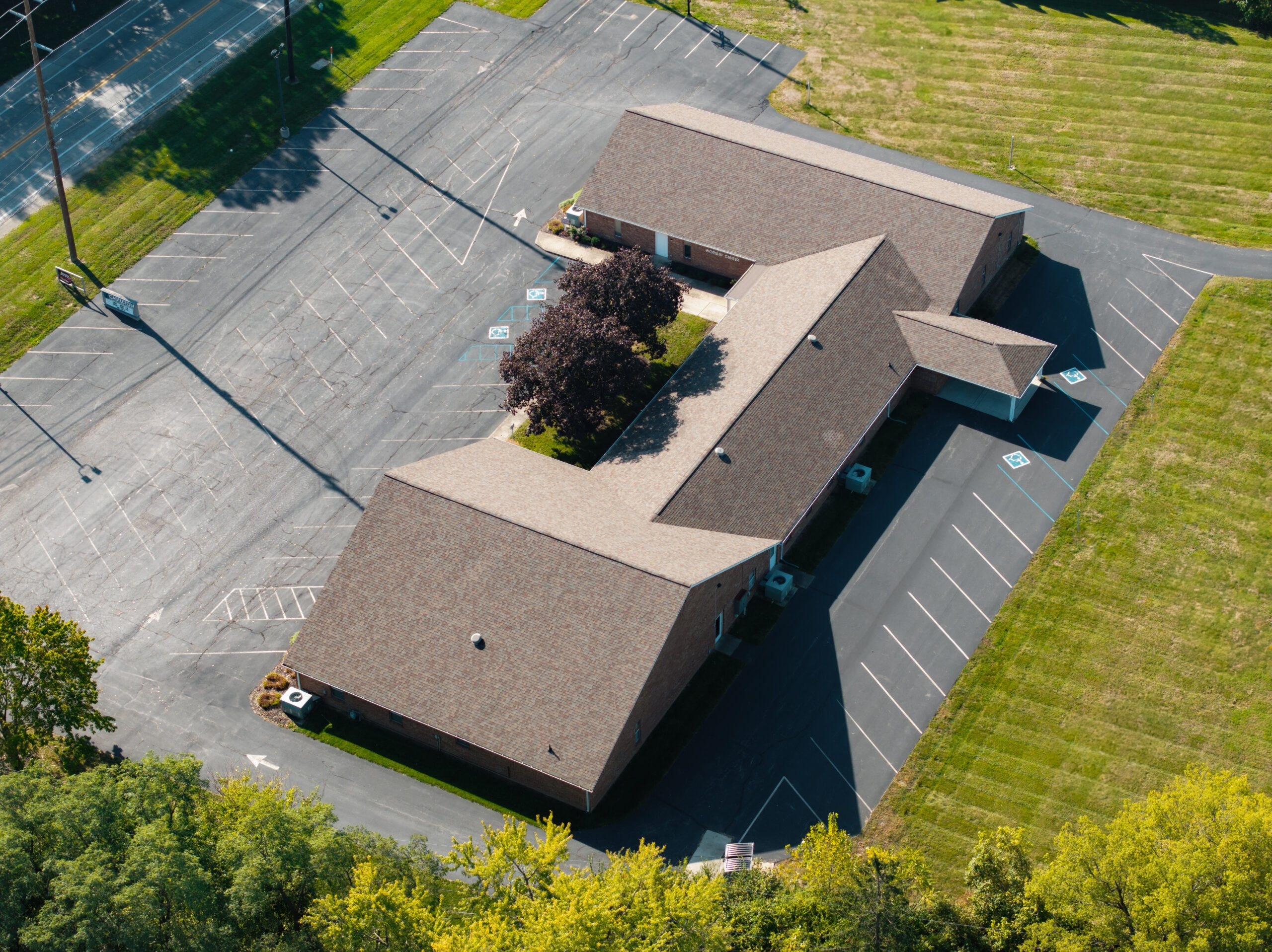 Aerial view of a large commercial church roof illustrating the scale and access of institutional roofing work