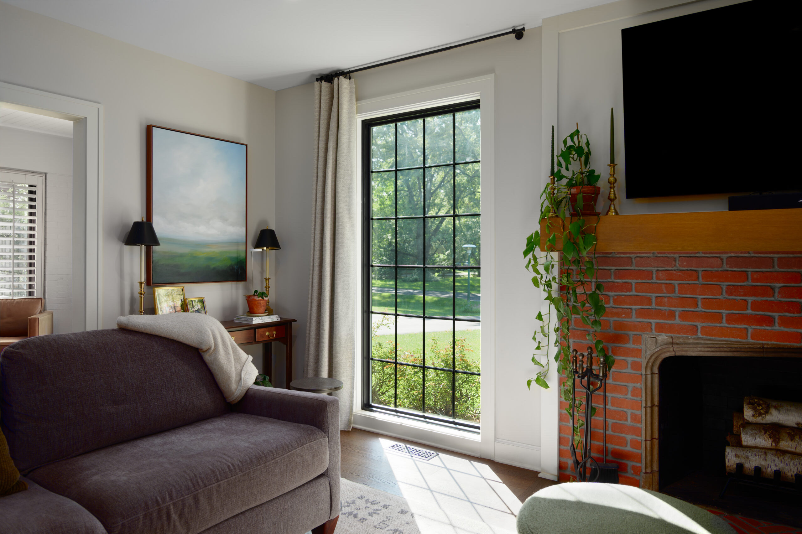 Custom black-grid window used as a strong architectural feature inside an Indianapolis home