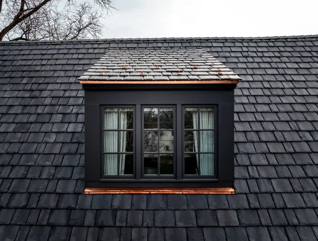 Hinsdale residence dormer window detail with slate-roof transition