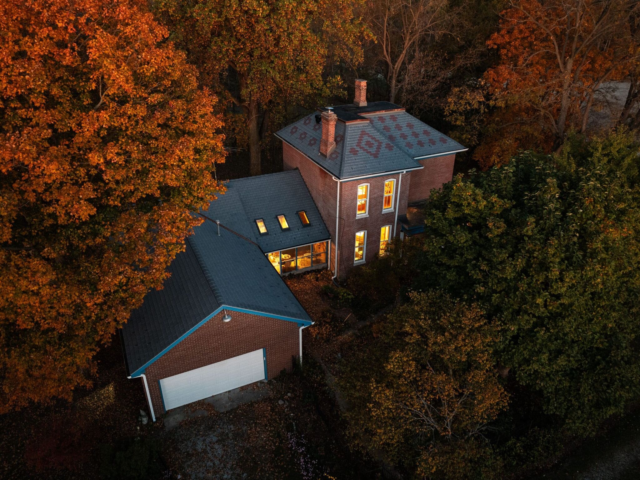 DaVinci composite slate roof on a brick home at golden hour