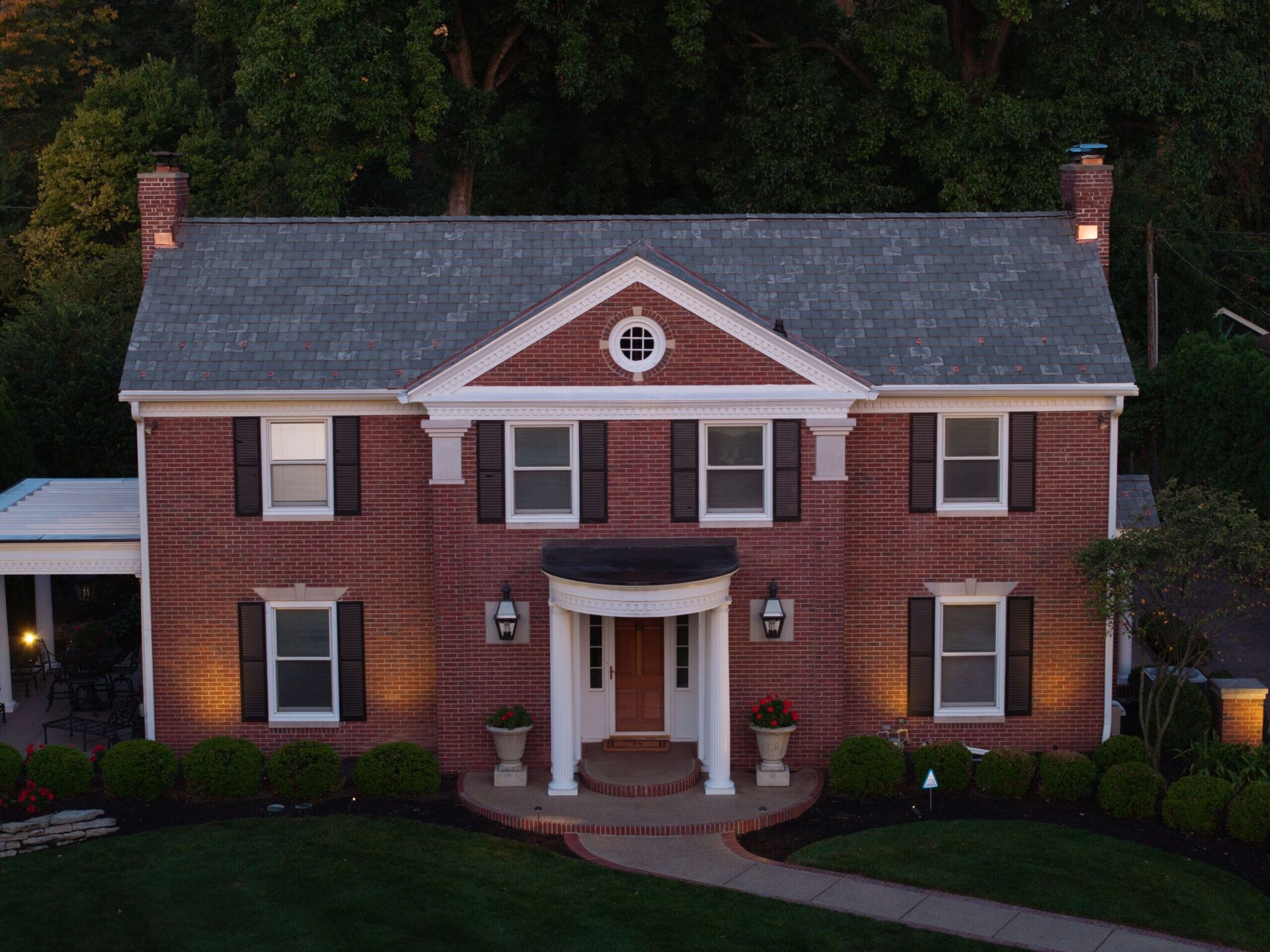 Brava synthetic slate roof with custom copper detailing on a large Indianapolis-area home
