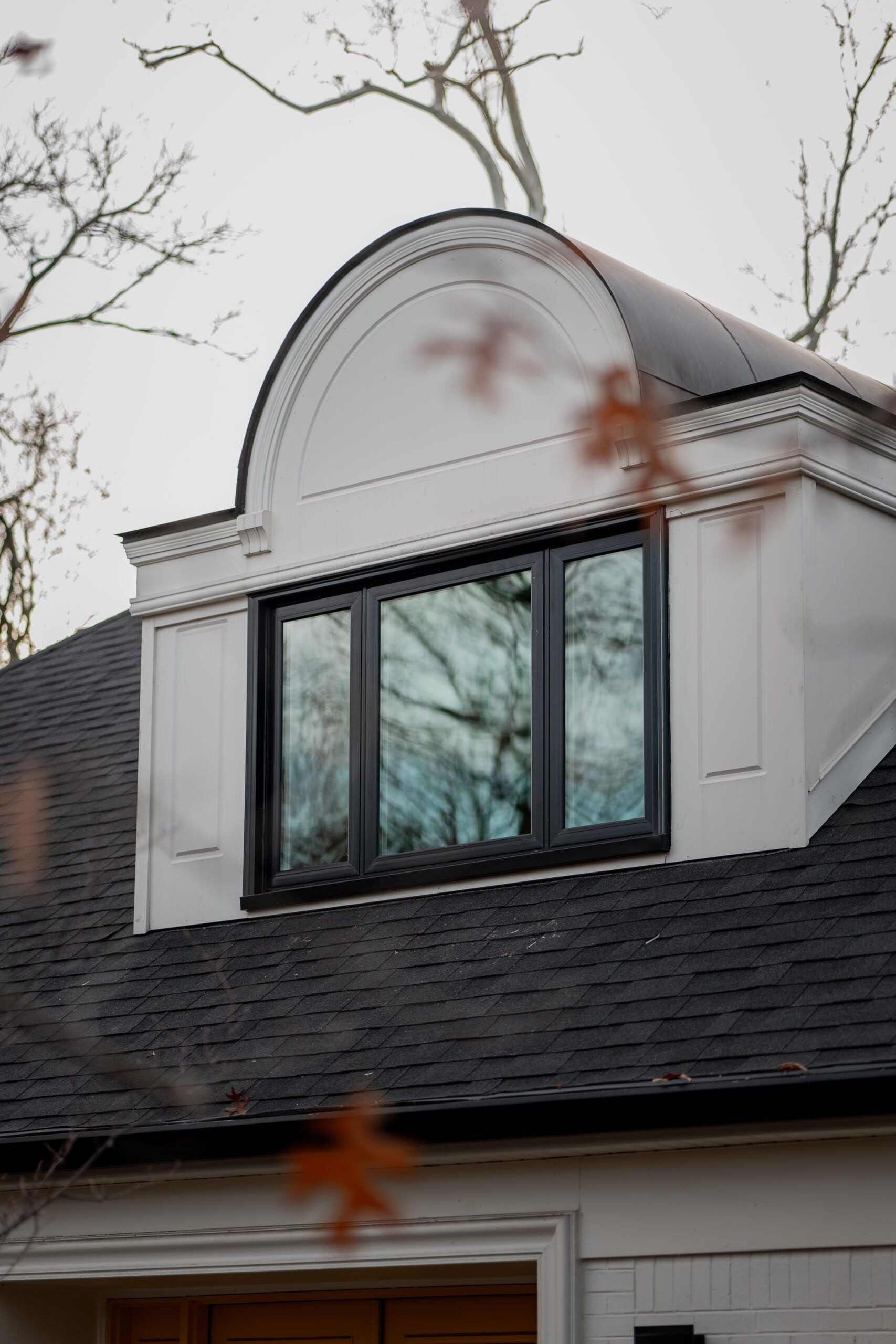Black-frame Pella window replacement detail on an Indianapolis residence by Locke & Ladder