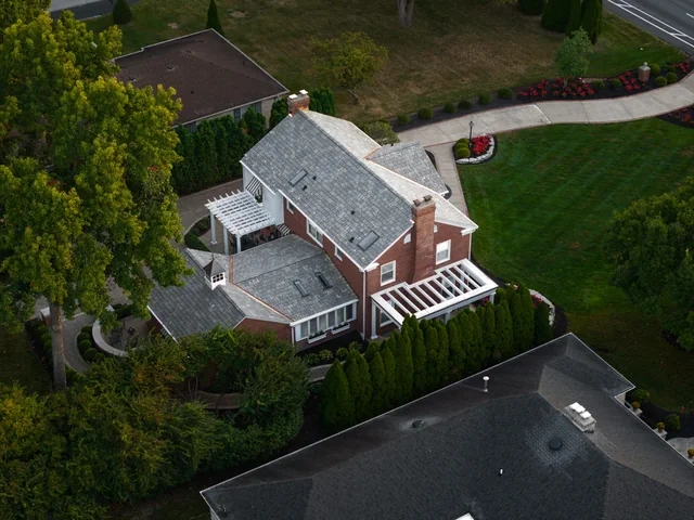 Copper snow stops on the Meridian Hills synthetic slate roof