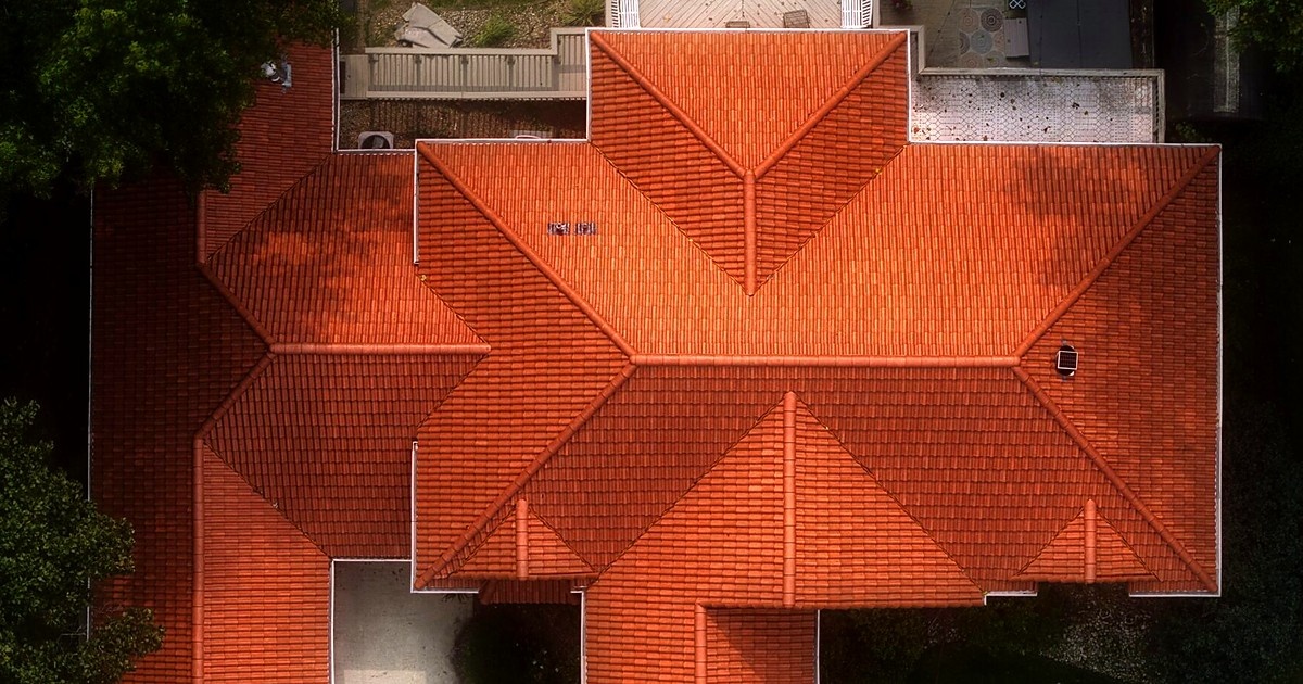 Aerial top-down view of the Antique Clay Spanish barrel tile roof by Locke & Ladder
