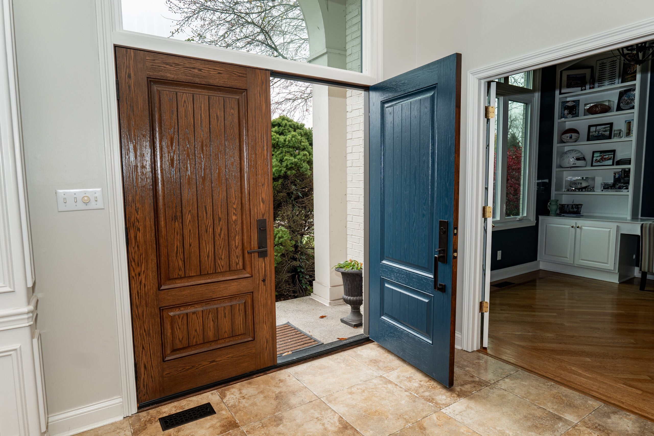 Wood and blue double entry doors on an Indianapolis home