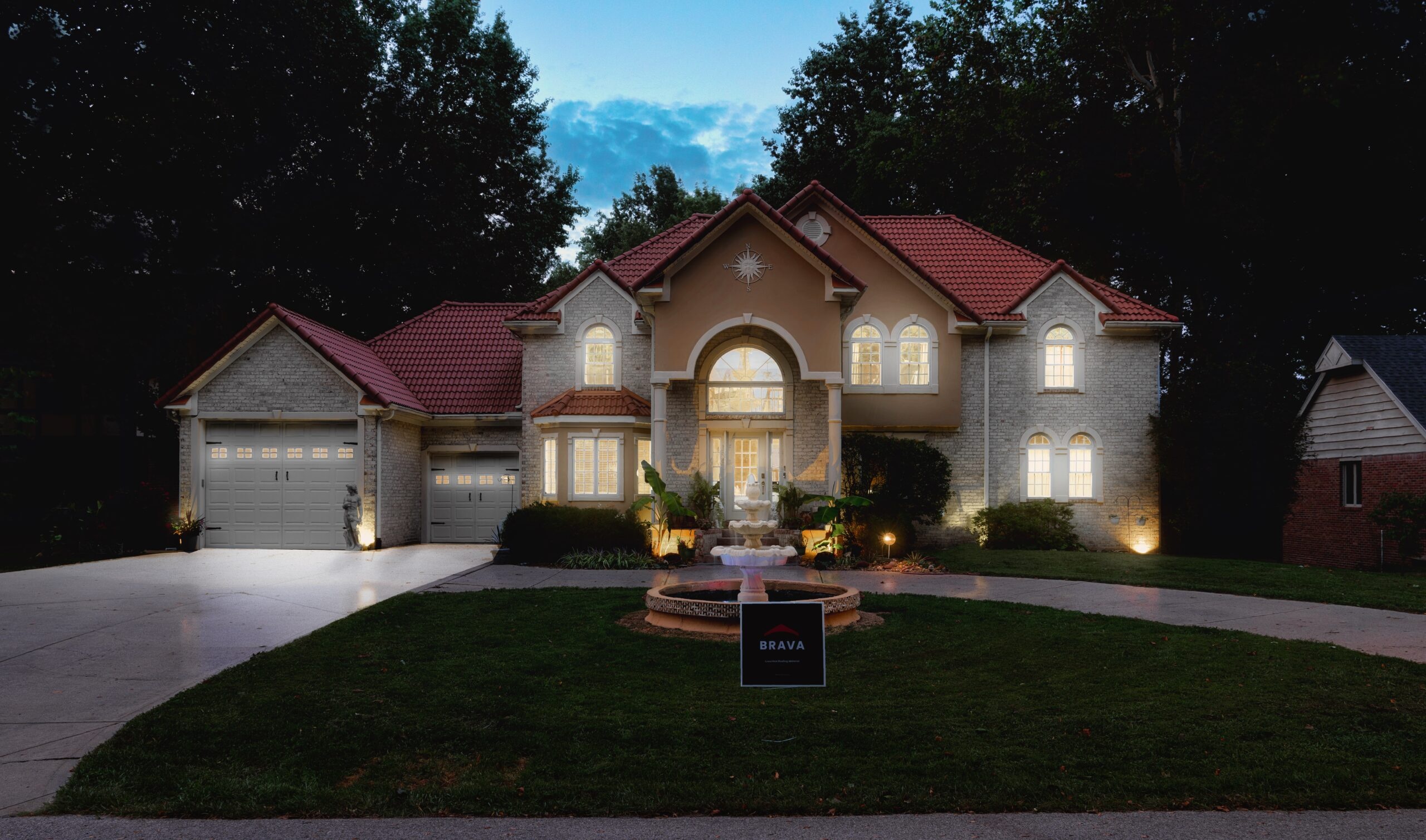 Locke & Ladder home exterior at twilight with a Brava synthetic cedar roof