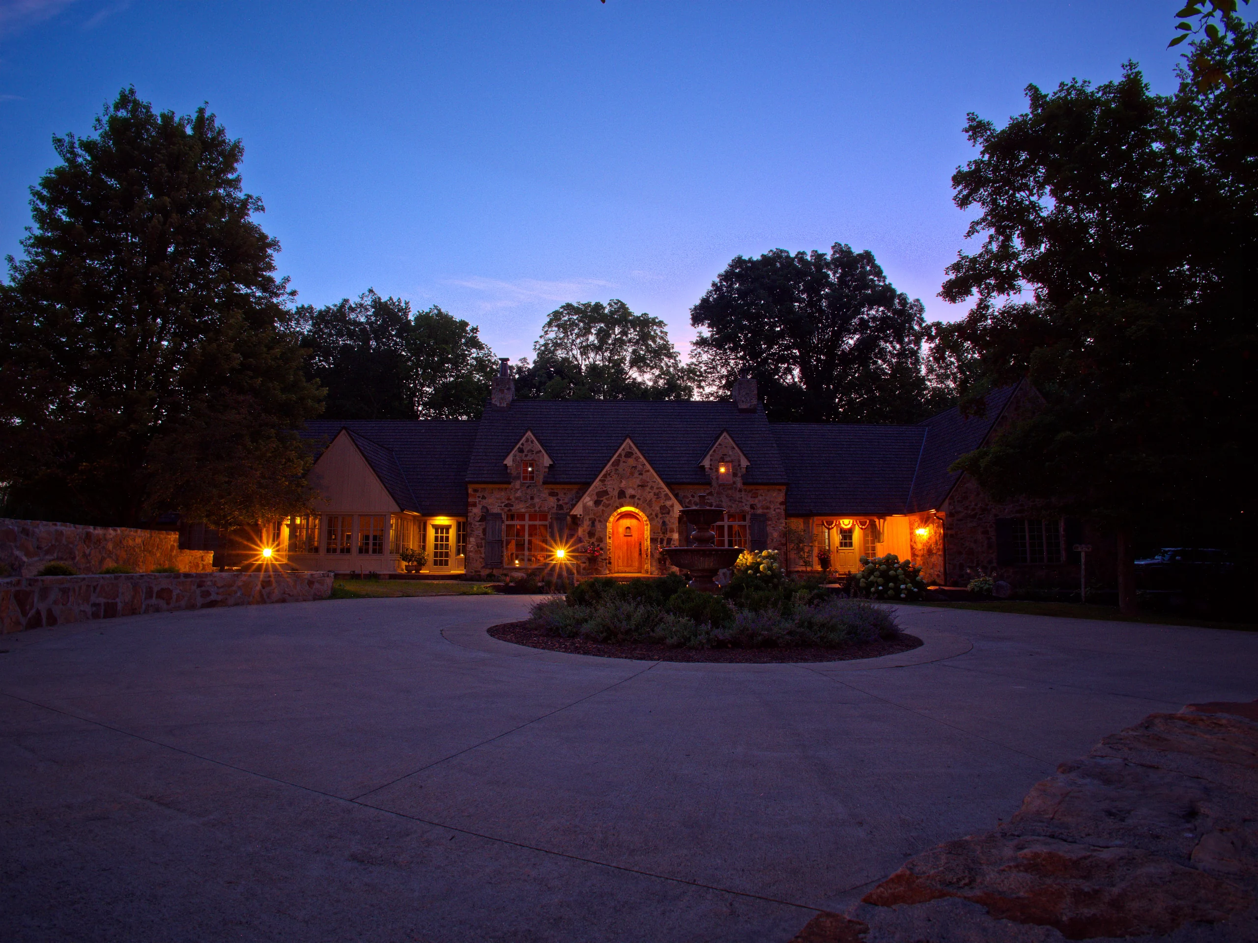 Front view of a Zionsville stone residence with a Brava composite cedar roof