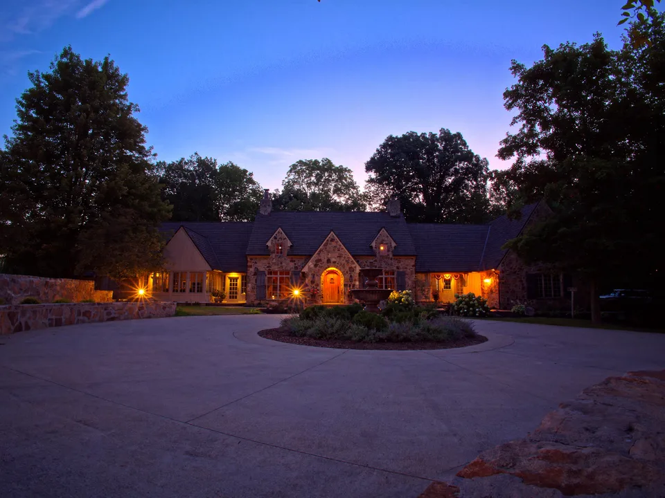 Front view of a Zionsville stone residence with a Brava composite cedar roof