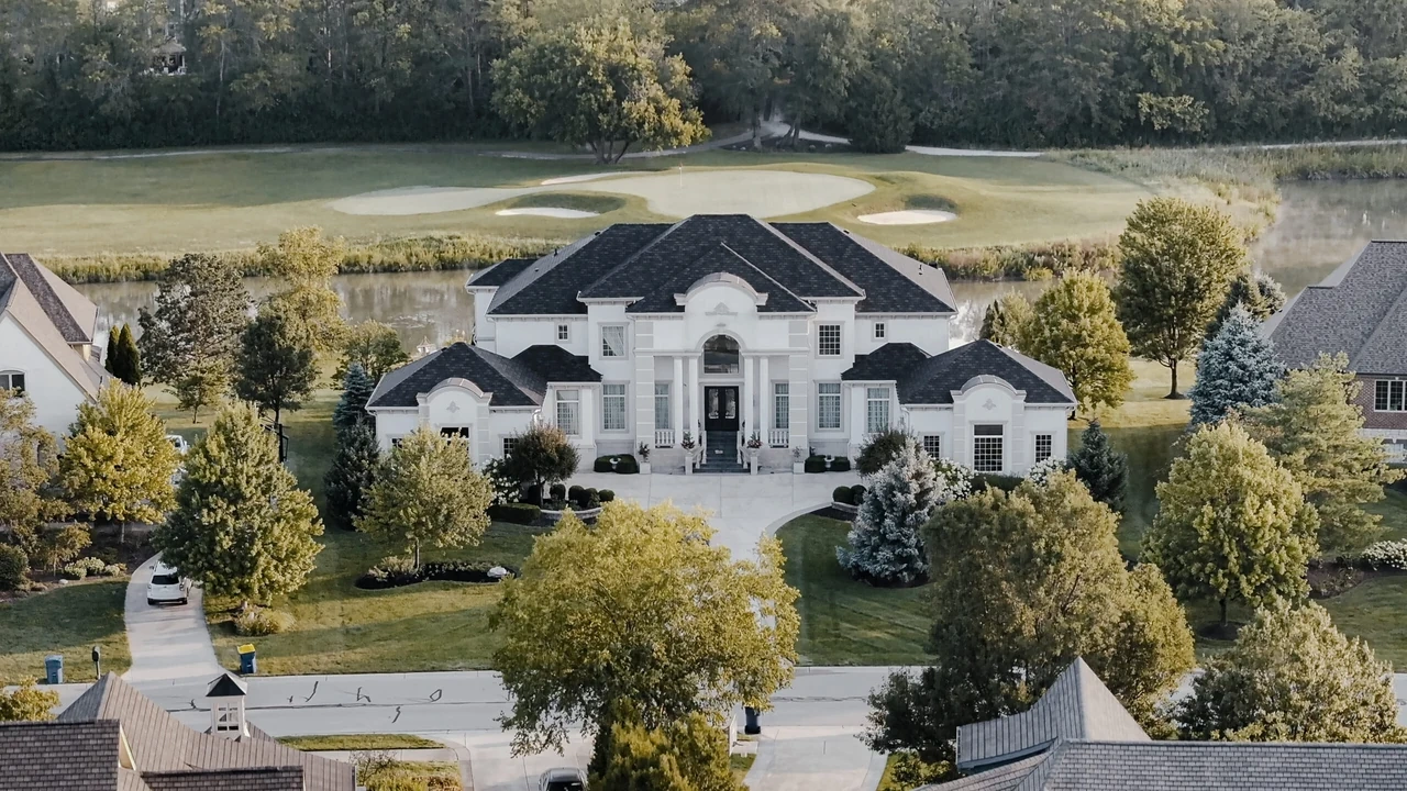 Estate home exterior with manicured grounds
