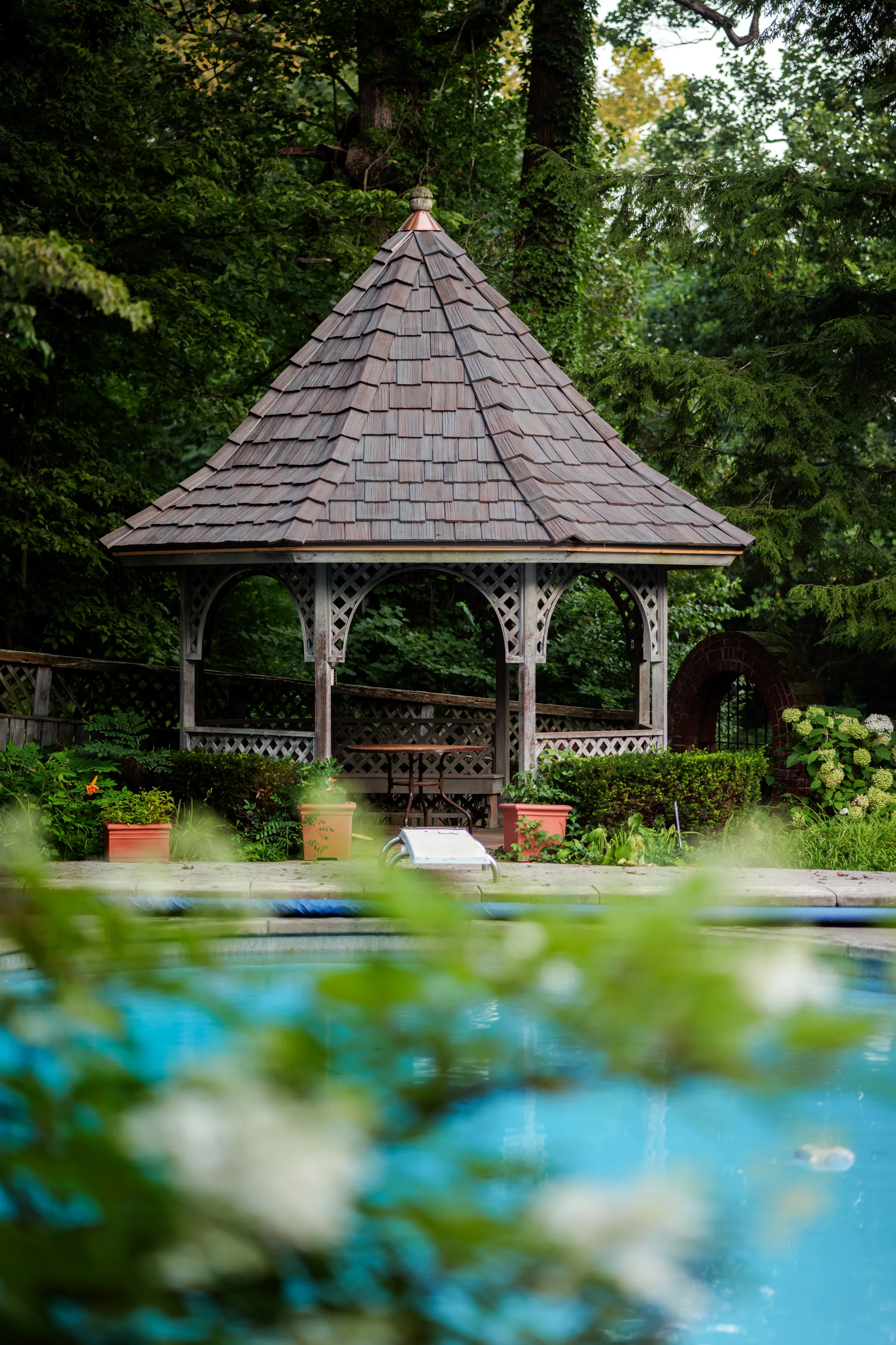 Gazebo with a matching staggered cedar roof in Bloomington, Indiana