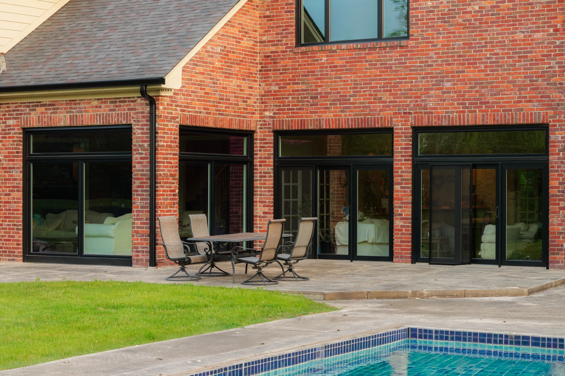 Black patio doors and windows facing the pool in Carmel, Indiana