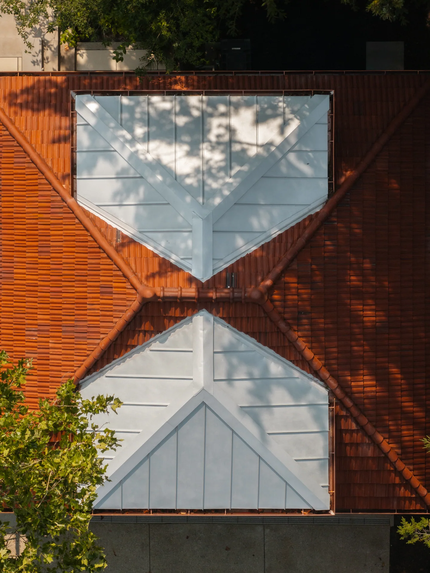 Clay tile roof and both standing-seam dormers from above in Indianapolis, Indiana