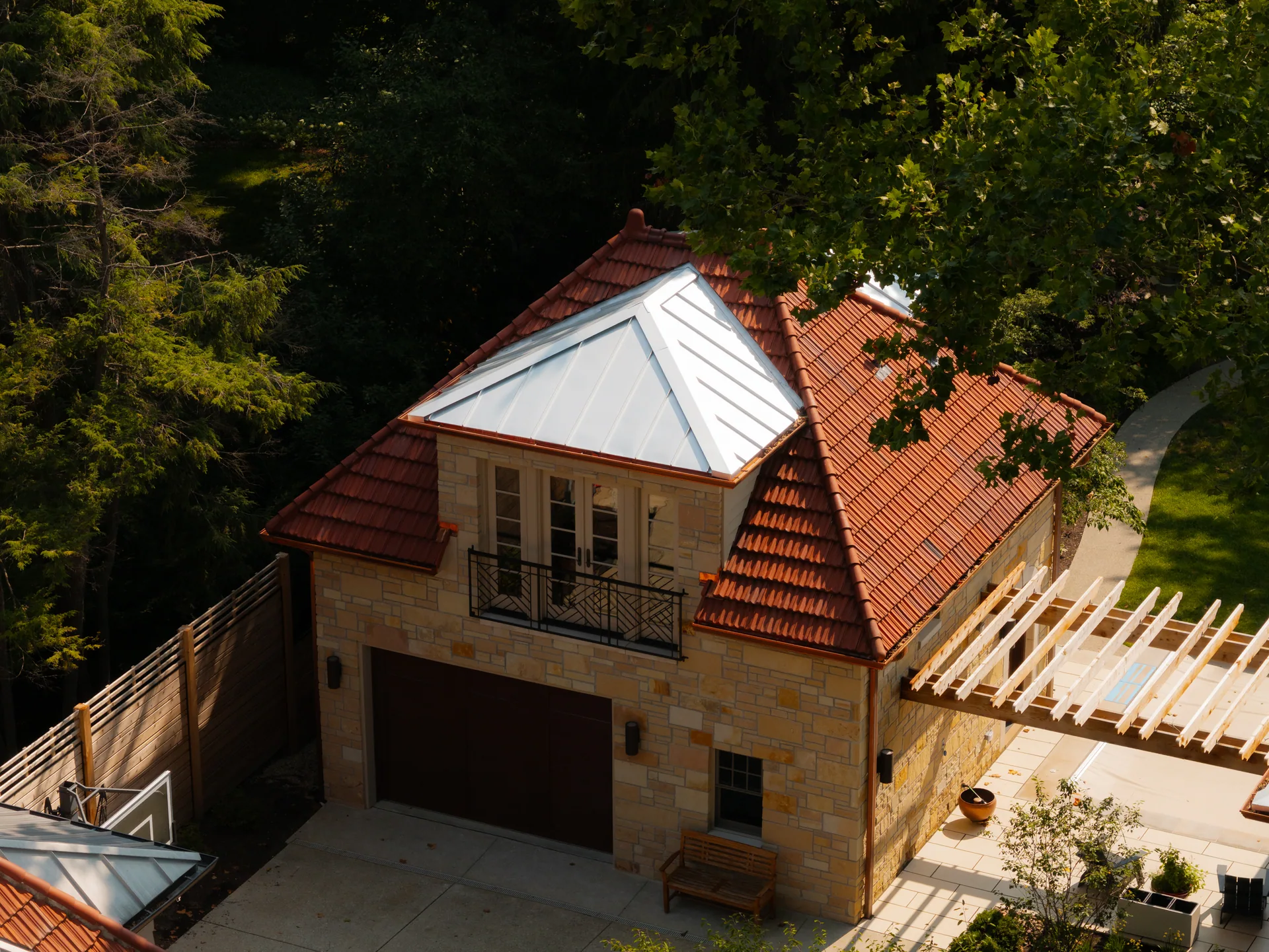 Garage with clay tile and standing-seam roofing in Indianapolis, Indiana