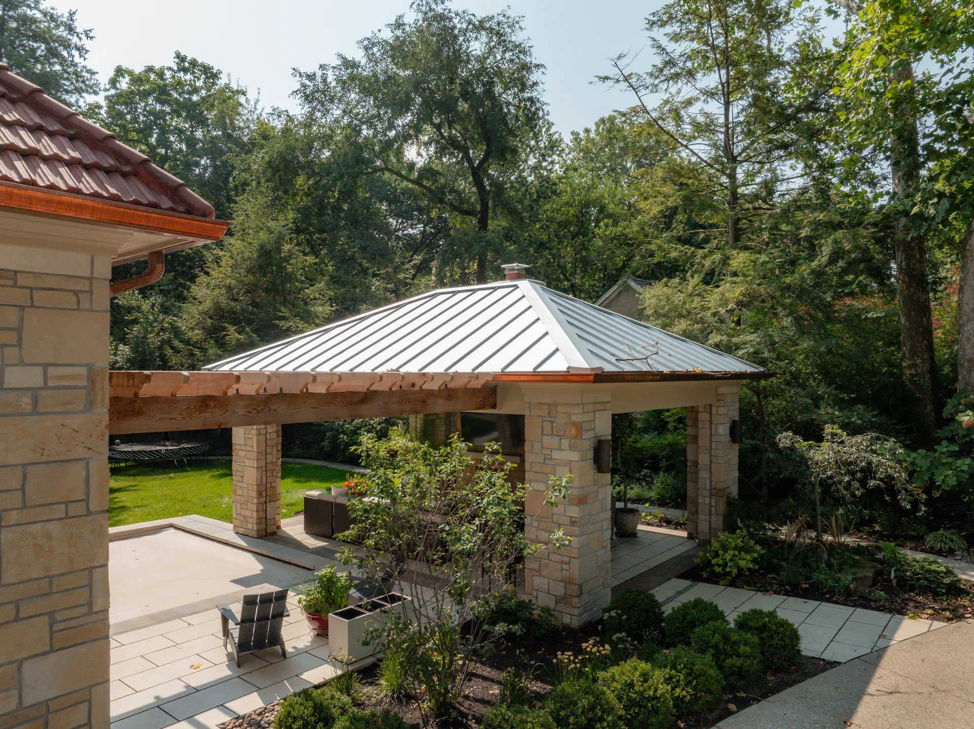 Pool house standing-seam roof beside the garden in Indianapolis, Indiana