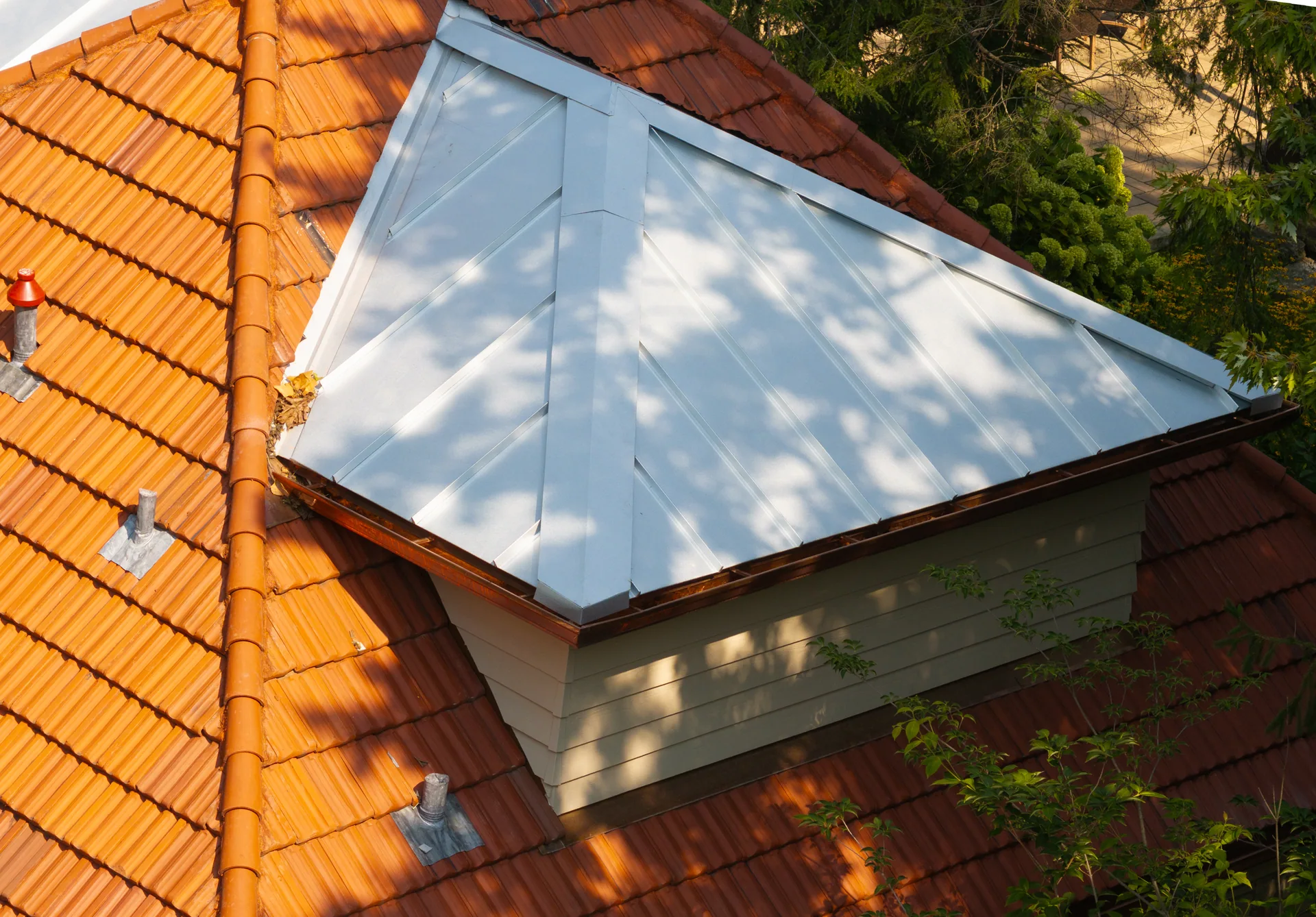 Standing seam beside Ludowici French tile in Indianapolis, Indiana