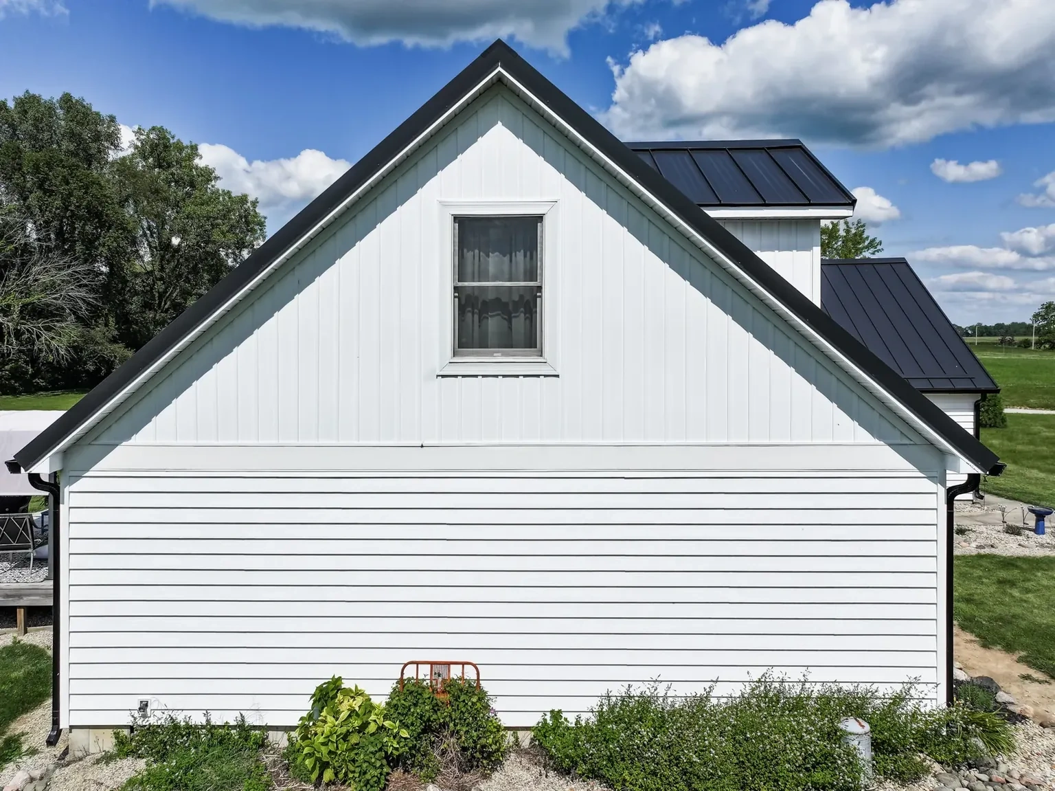 Standing-seam metal roofing, siding, windows and doors project in Kirklin, IN, photo 7 of 8