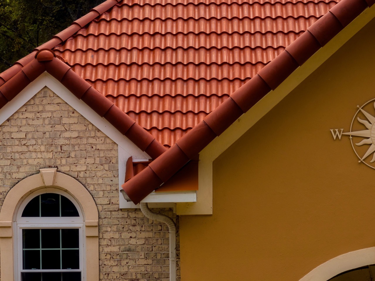 Close view of the curved profile and ridge pieces on a Brava barrel-tile roof