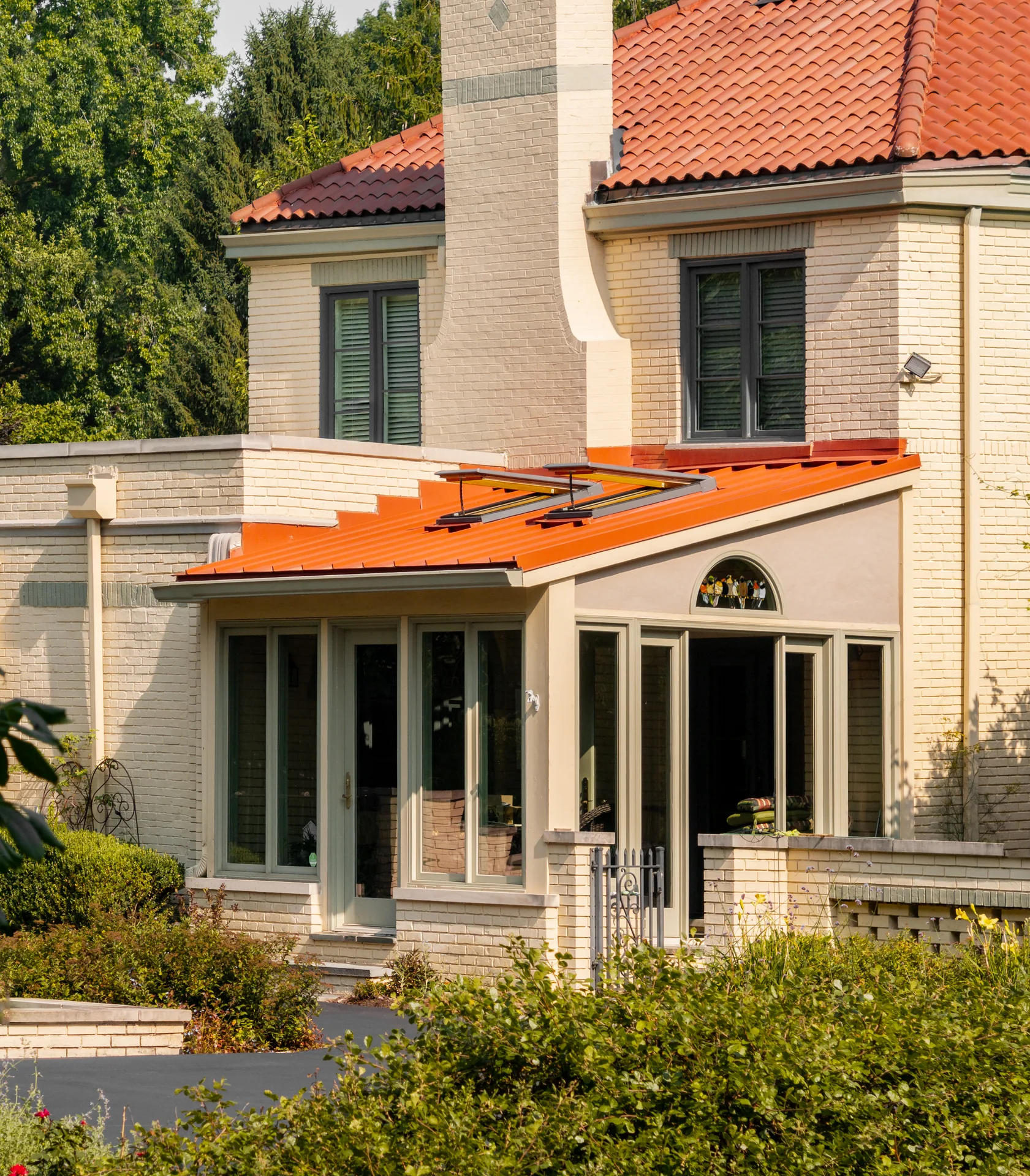 Standing-seam porch roof beneath the chimney in Meridian Hills, Indiana