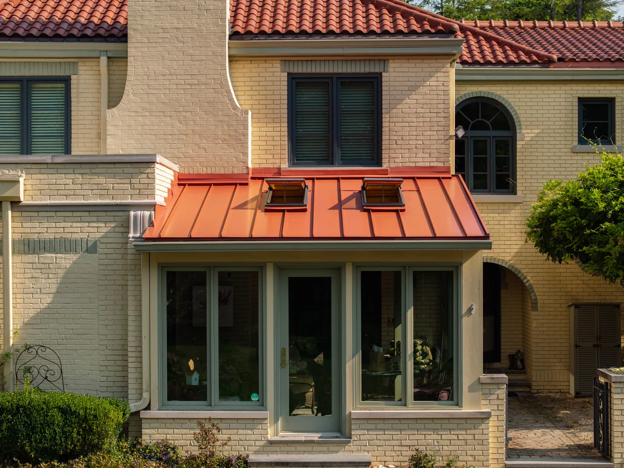 Terra Cotta standing-seam porch roof with skylights in Meridian Hills, Indiana