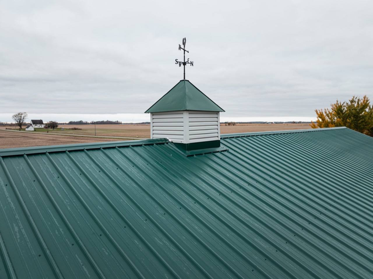 Commercial exposed-fastener metal roofing and gutters project in Michigantown, IN, photo 3 of 8