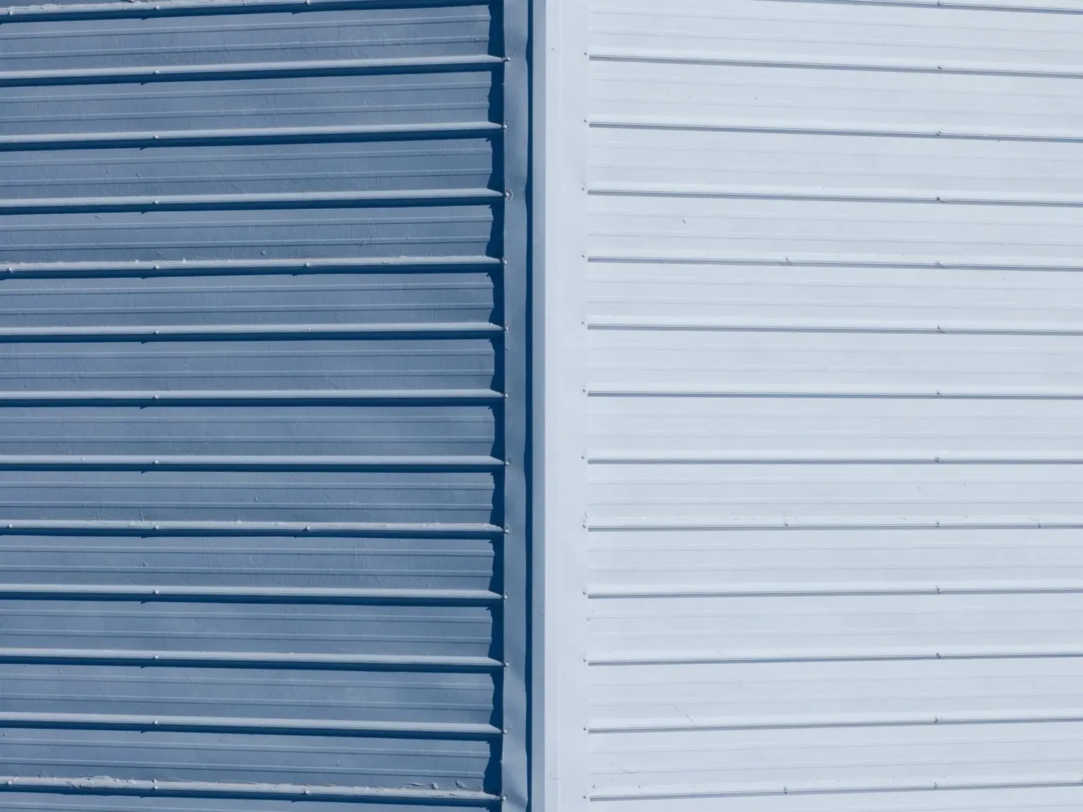 Close comparison of commercial metal wall-cladding profiles and panel colors