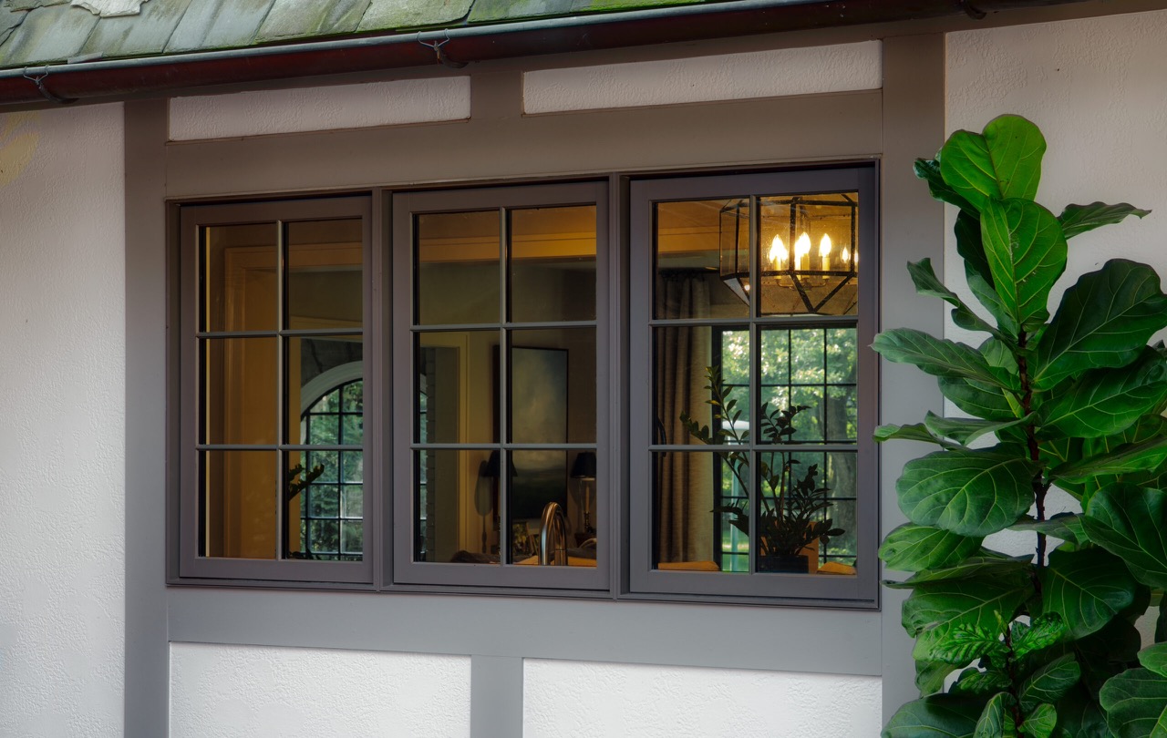 Three black-framed casement window sashes on a Wynnedale home in Indianapolis