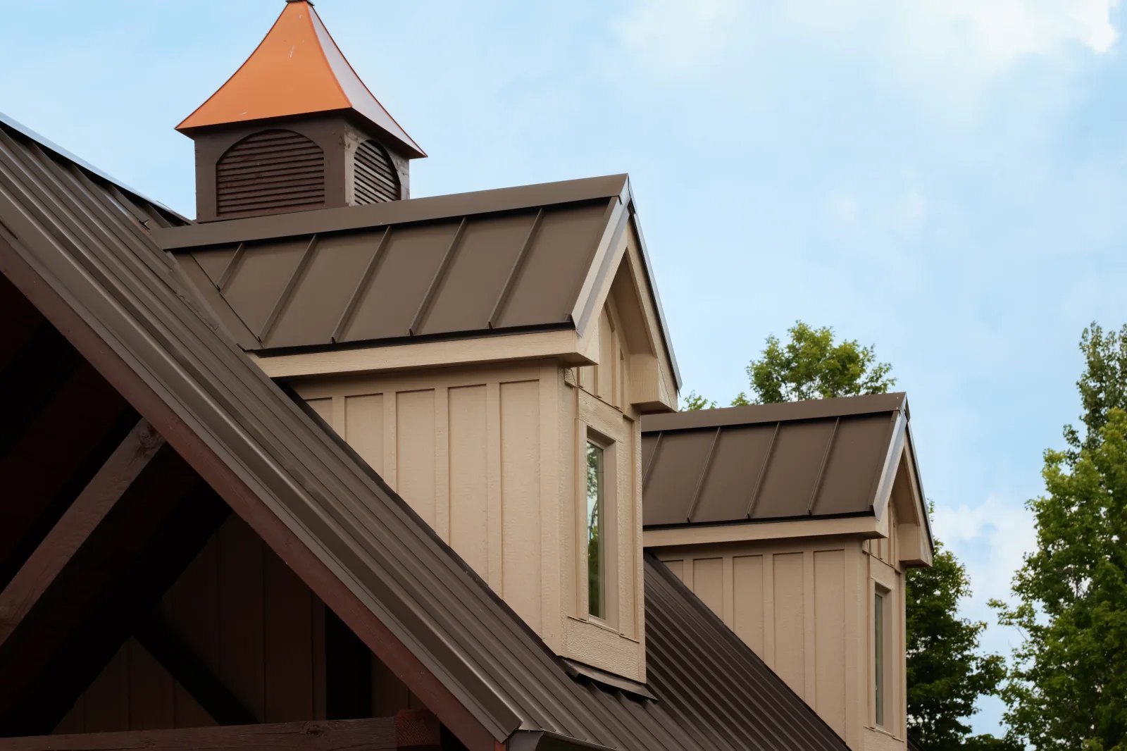 Pool-house cupola, rake trim, and standing-seam roof detail