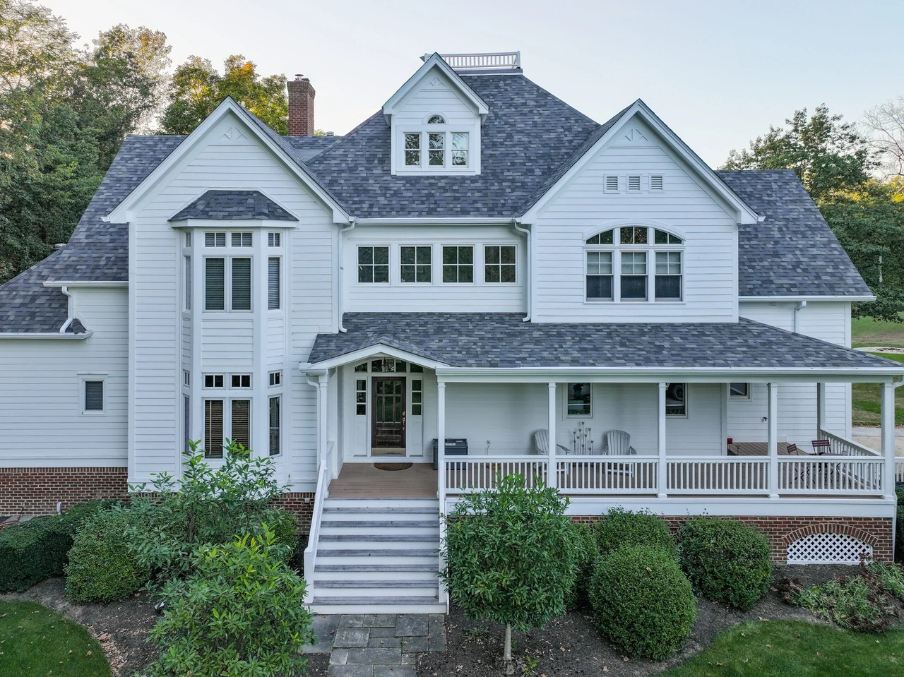 Restored exterior on a historic white Victorian home