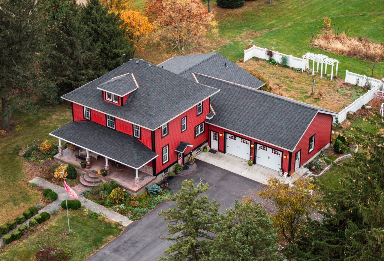 Roof, siding, and windows project on a red home in Michigantown, Indiana