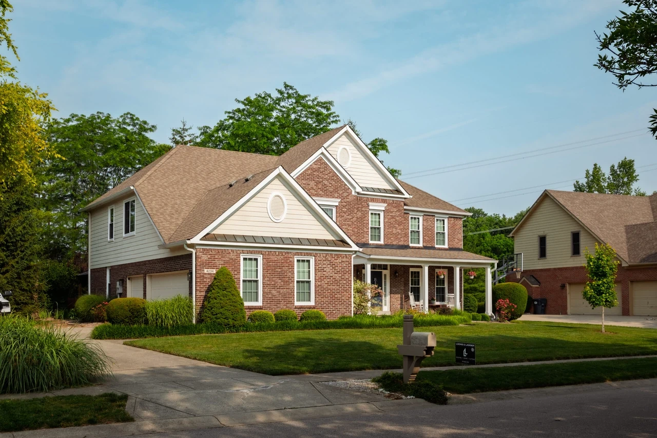 New window package and trim on a brick home
