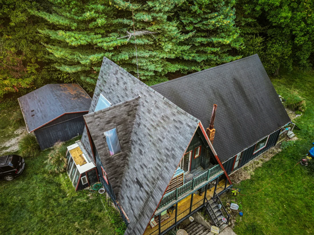 Existing roof edges before replacement, where starter courses and perimeter protection begin