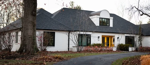 Black-frame window package detail on a Spring Mill residence